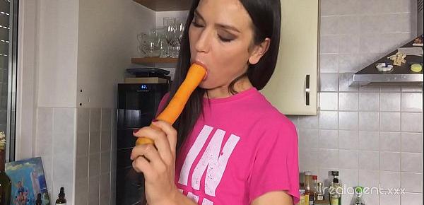  Russian pornstar Nataly Gold rubs her hole with carrot in the kitchen